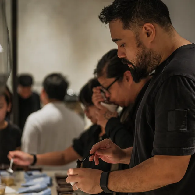 Gil Erez cupping coffee at a tasting table